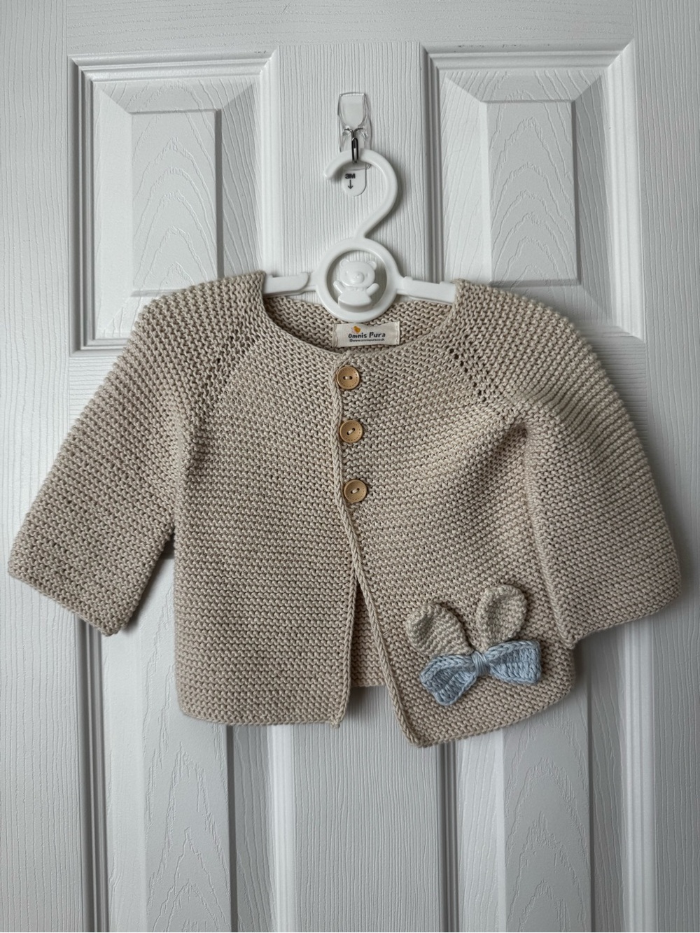 Cream Knit Baby Cardigan with Bow Accent